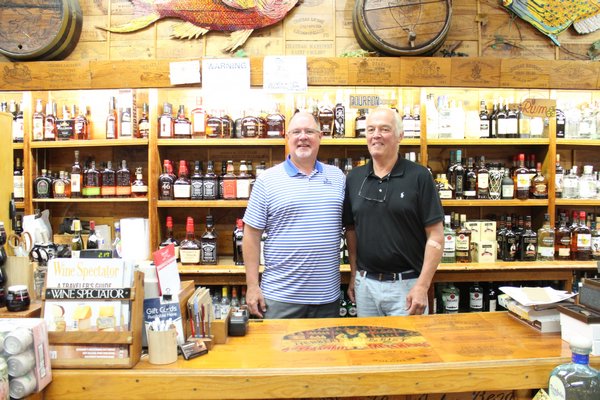 John Noonan and John Rist behind the counter